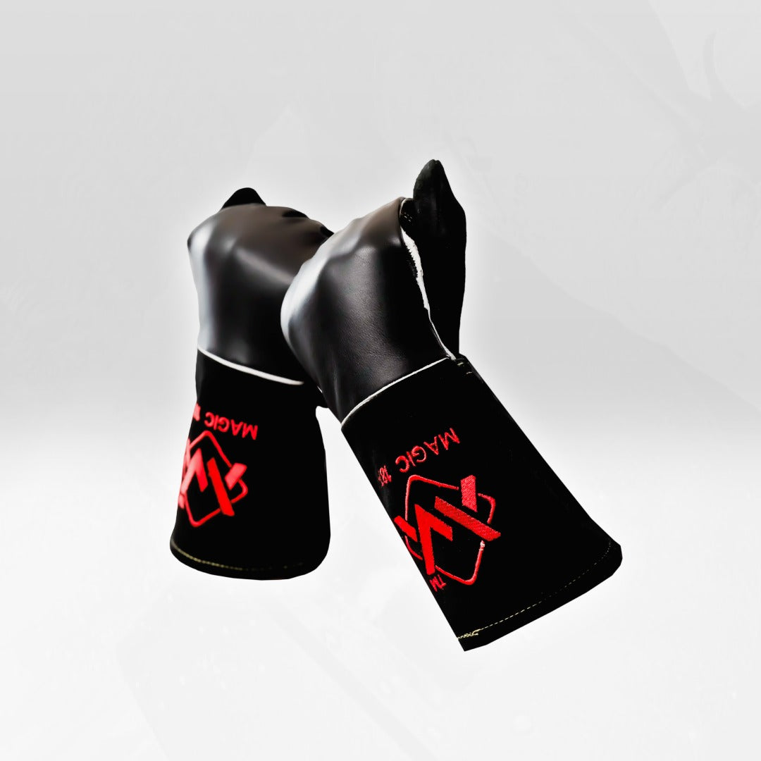 Black shin guards with red logo on a white background