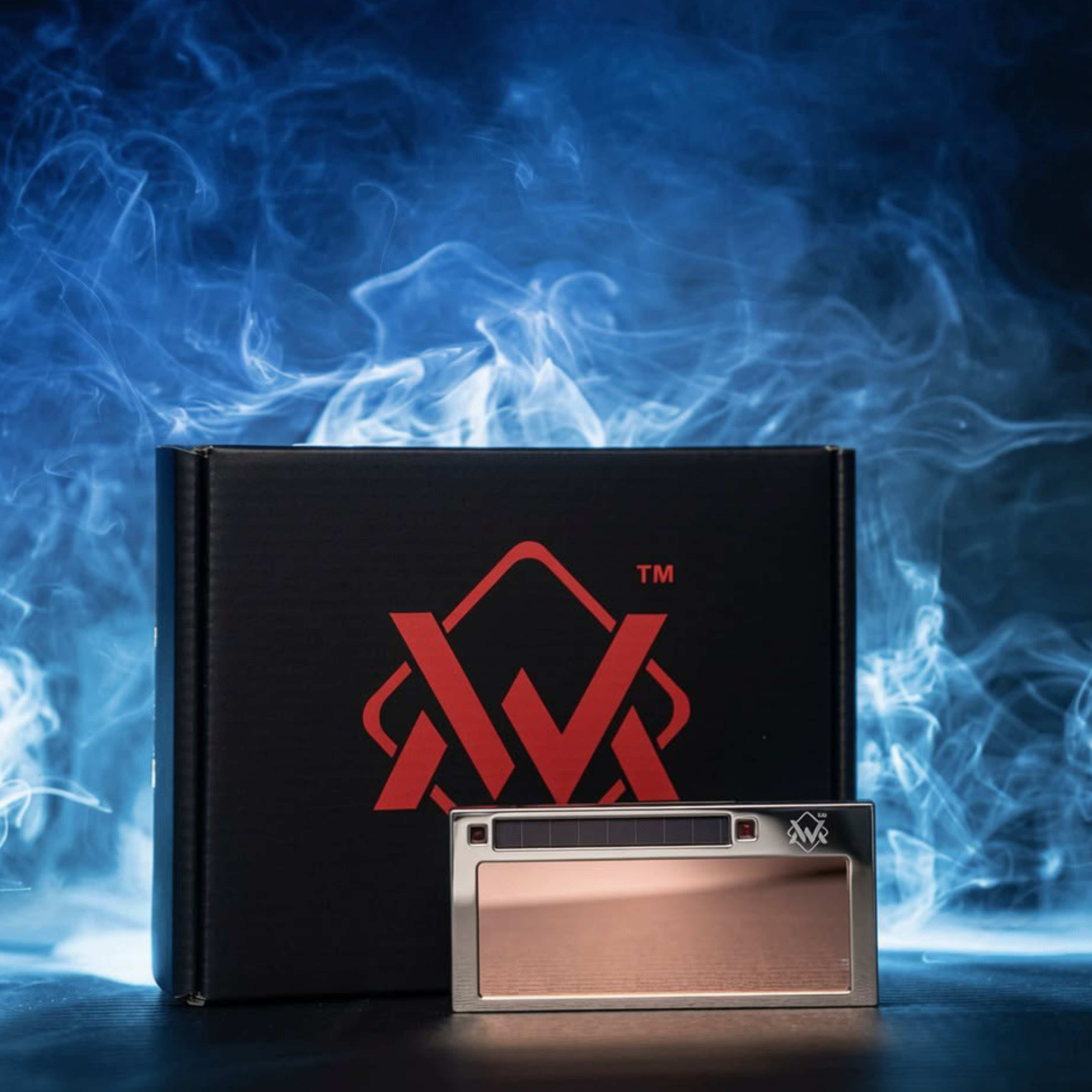 24K Pro stainless steel True Color auto-darkening welding lens with black Welding Magician packaging against blue welding smoke