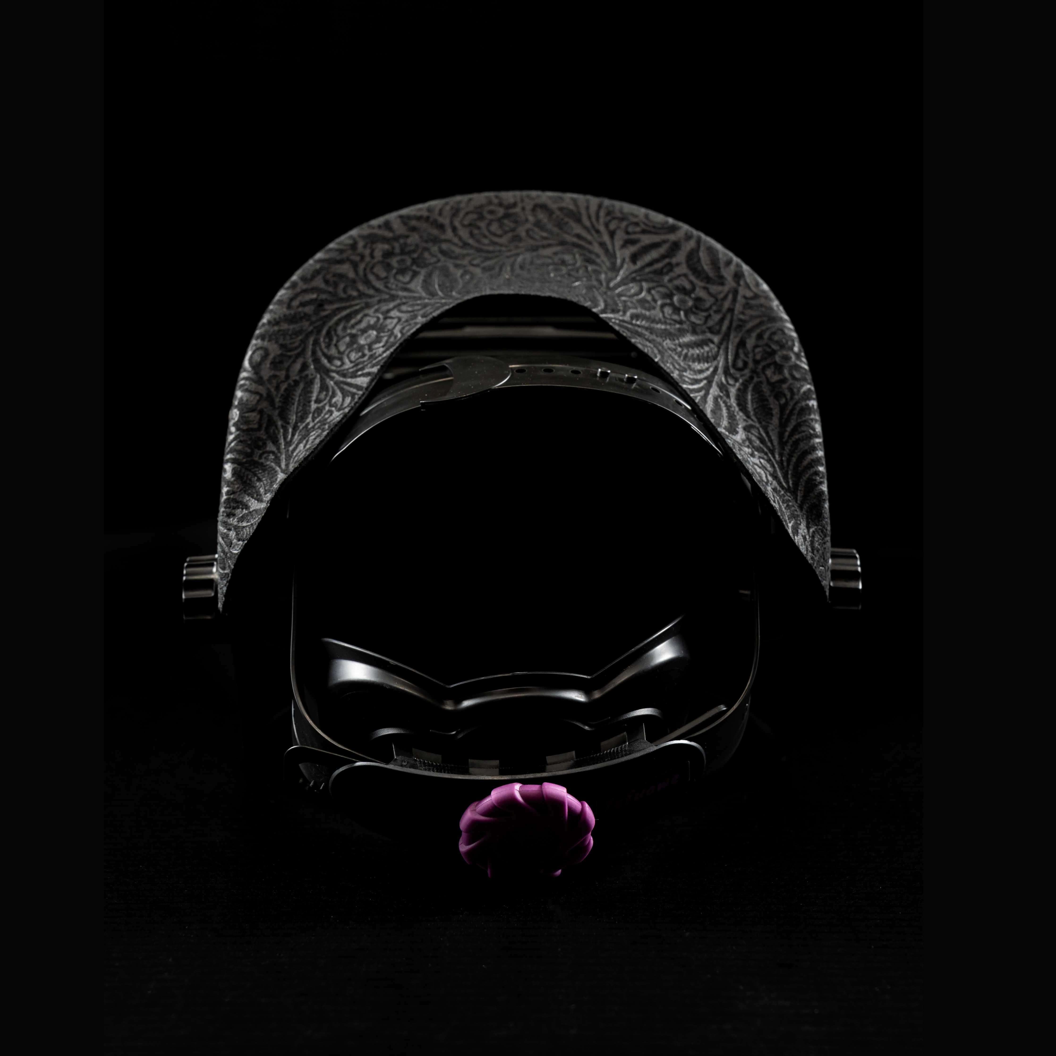 Back view highlighting black floral leather detail on headband and comfortable adjustable fit.