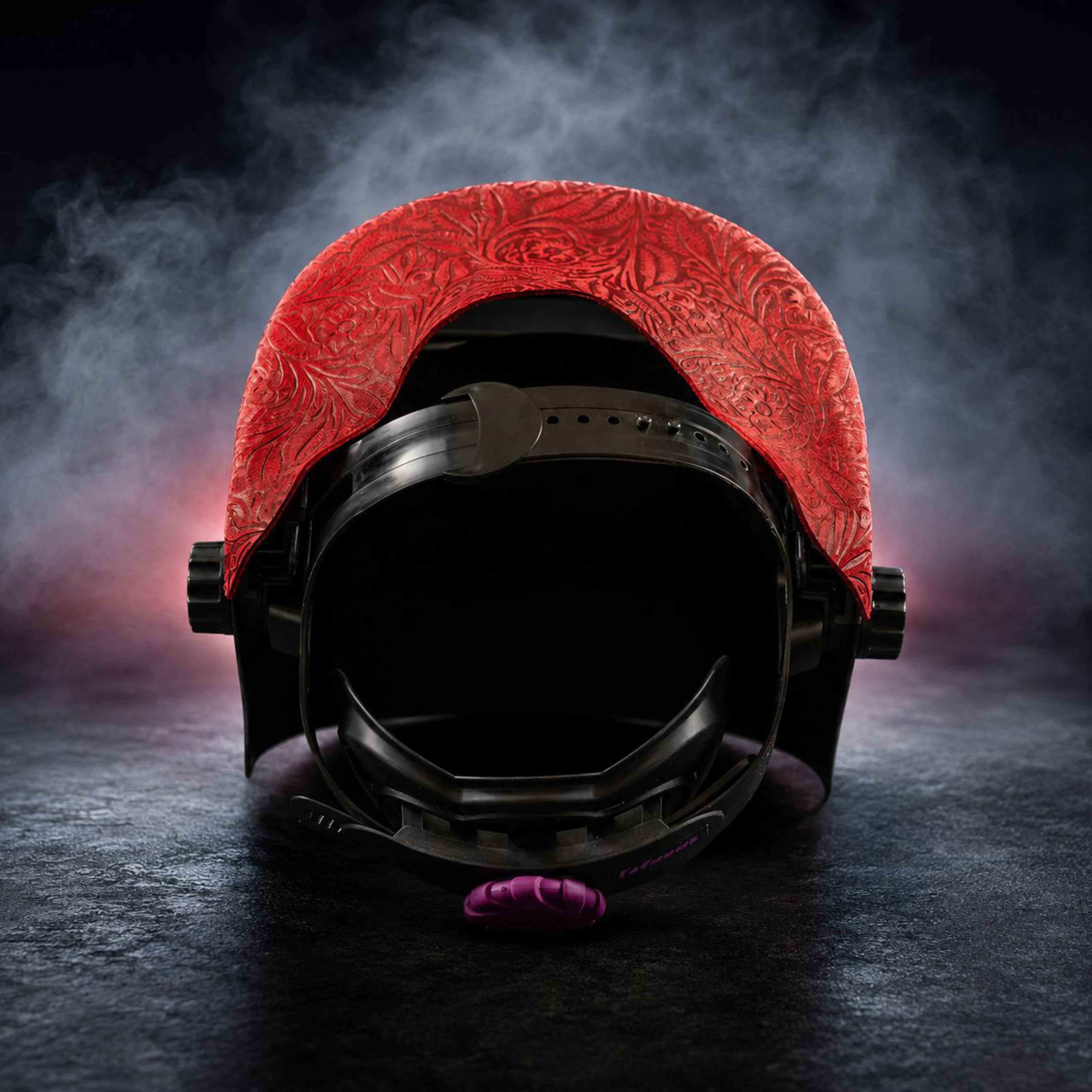 Interior view showing red floral patterned leather and ergonomic support strap.