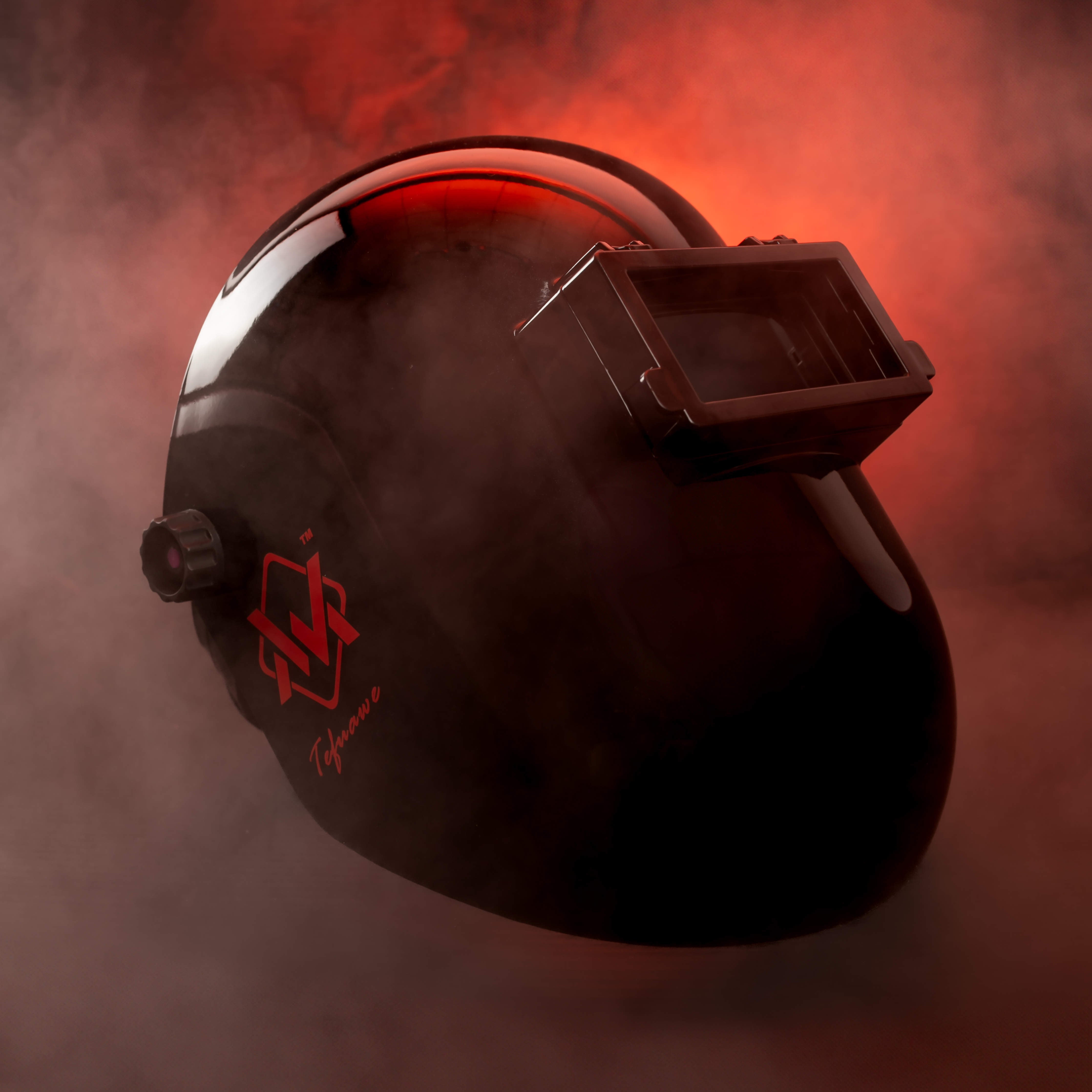BlazeShield Welding Hood in black with red lighting, side view emphasizing bold design and protection.