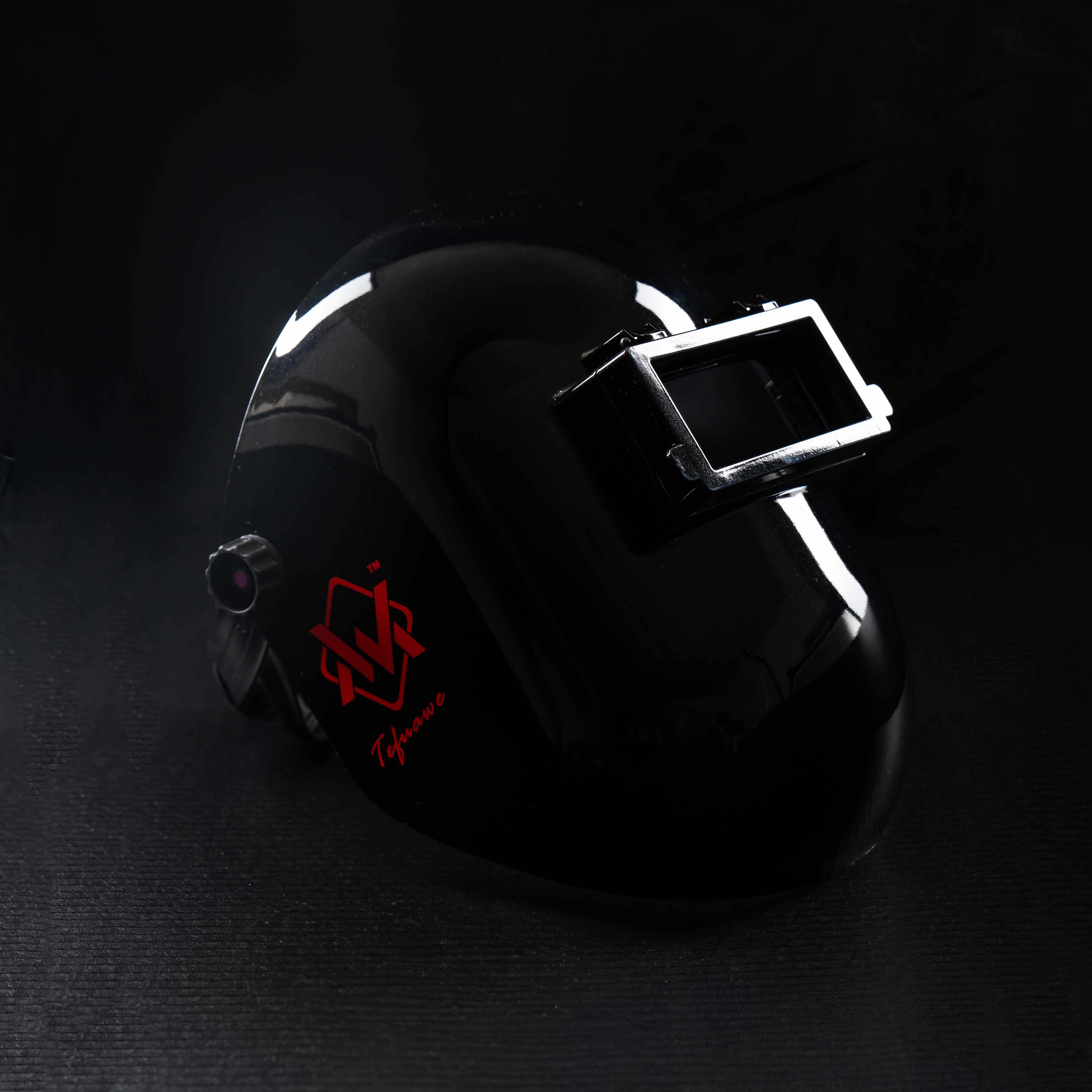 BlazeShield Flip Lens Welding Hood in black with red logo, side view showing durable shell and flip lens.