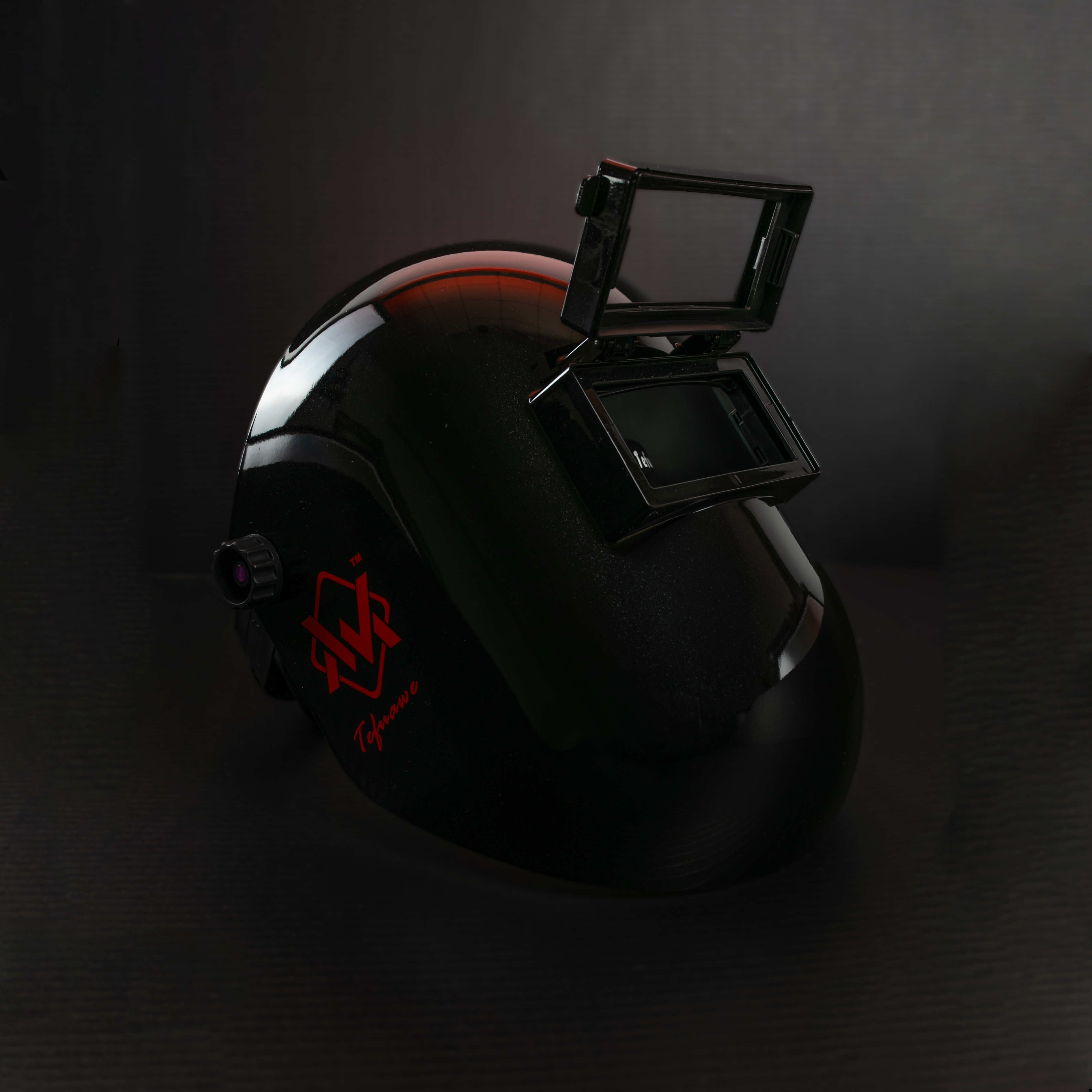 Black BlazeShield Welding Hood with red logo, angled front view highlighting open flip lens design.