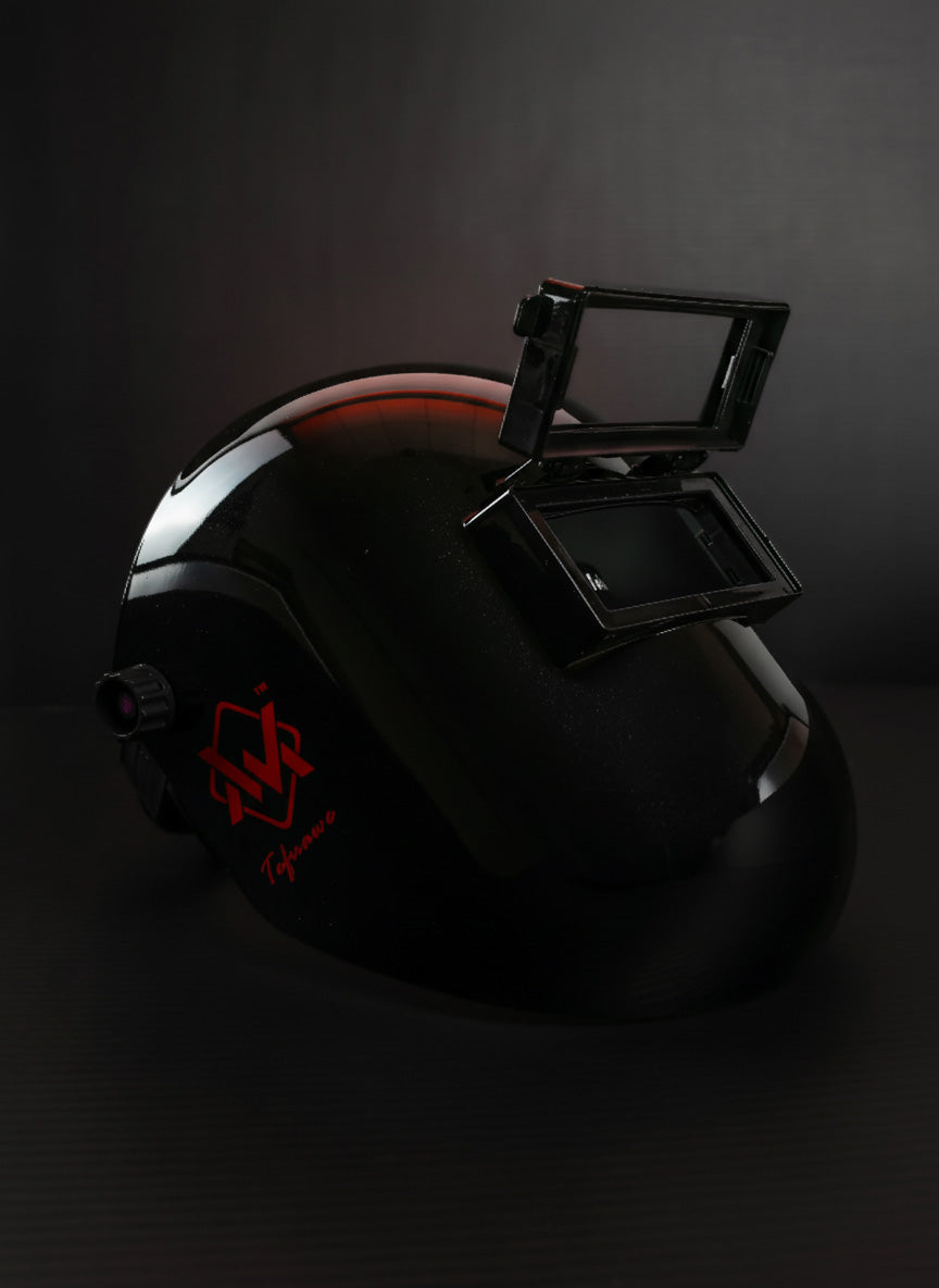 Black helmet with a red logo on a dark background