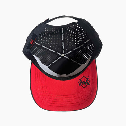 Inside view of Magician Performance Logo Cap in Black, showing red visor, black trim, and ventilated lining for airflow.