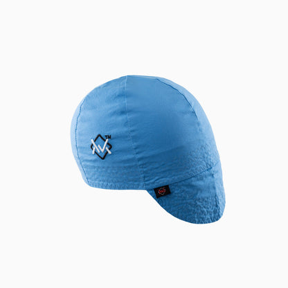 The Magician Grip Welding Cap in blue with white embroidered logo, breathable cotton design for welders.
