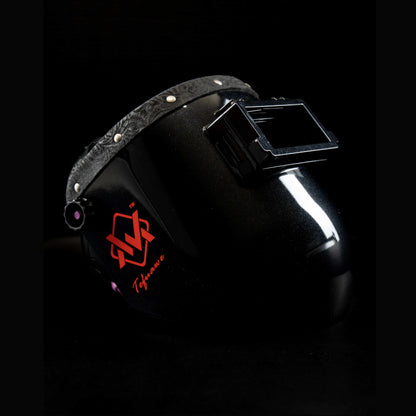 EliteWave Flip Lens Welding Hood with black floral leather trim, side view showing glossy shell and lens.