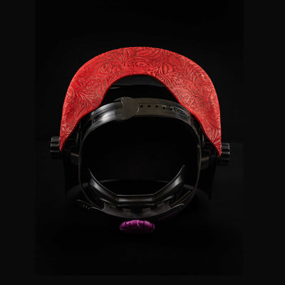 Interior view showing red floral patterned leather and ergonomic support strap.