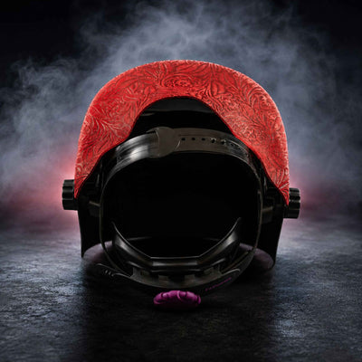 Interior view showing red floral patterned leather and ergonomic support strap.
