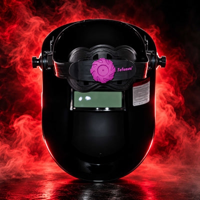 Interior view of BlazeShield Flip Lens Welding Hood showing adjustable headgear, purple adjustment knob and red smoke background.