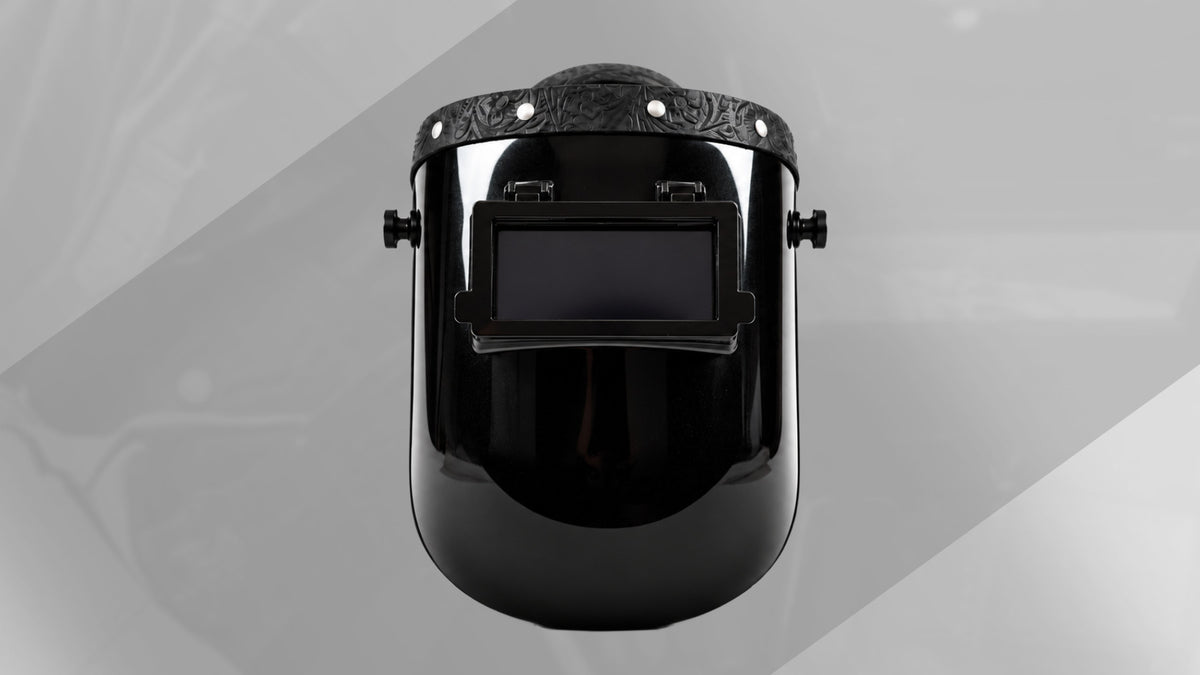 EliteWave Flip Lens Welding Hood featuring black floral embossed leather trim, silver rivets and rectangular flip-up lens.
