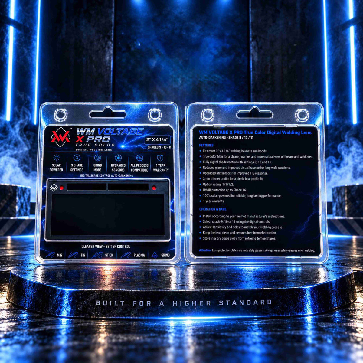 Front and back packaging of the WM Voltage X Pro True Color auto-darkening welding lens on a welding table